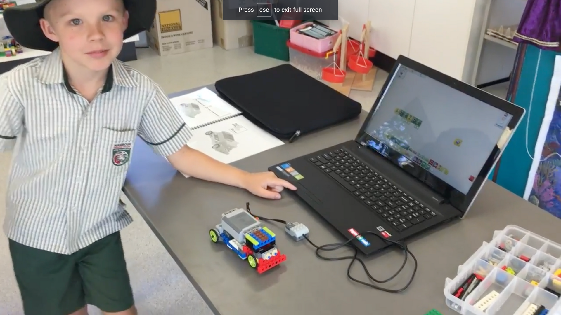 boy studying coding with robots