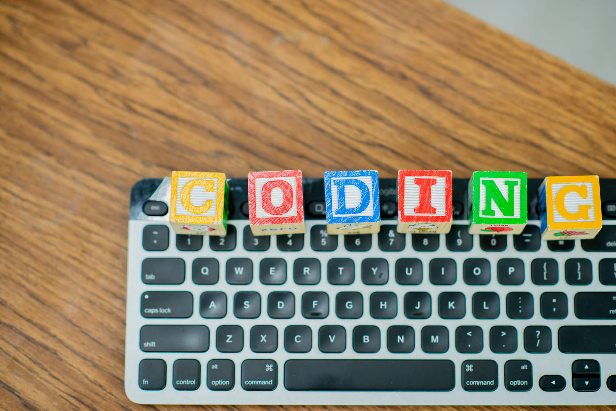 Picture of a keyboard with the word 'Coding'