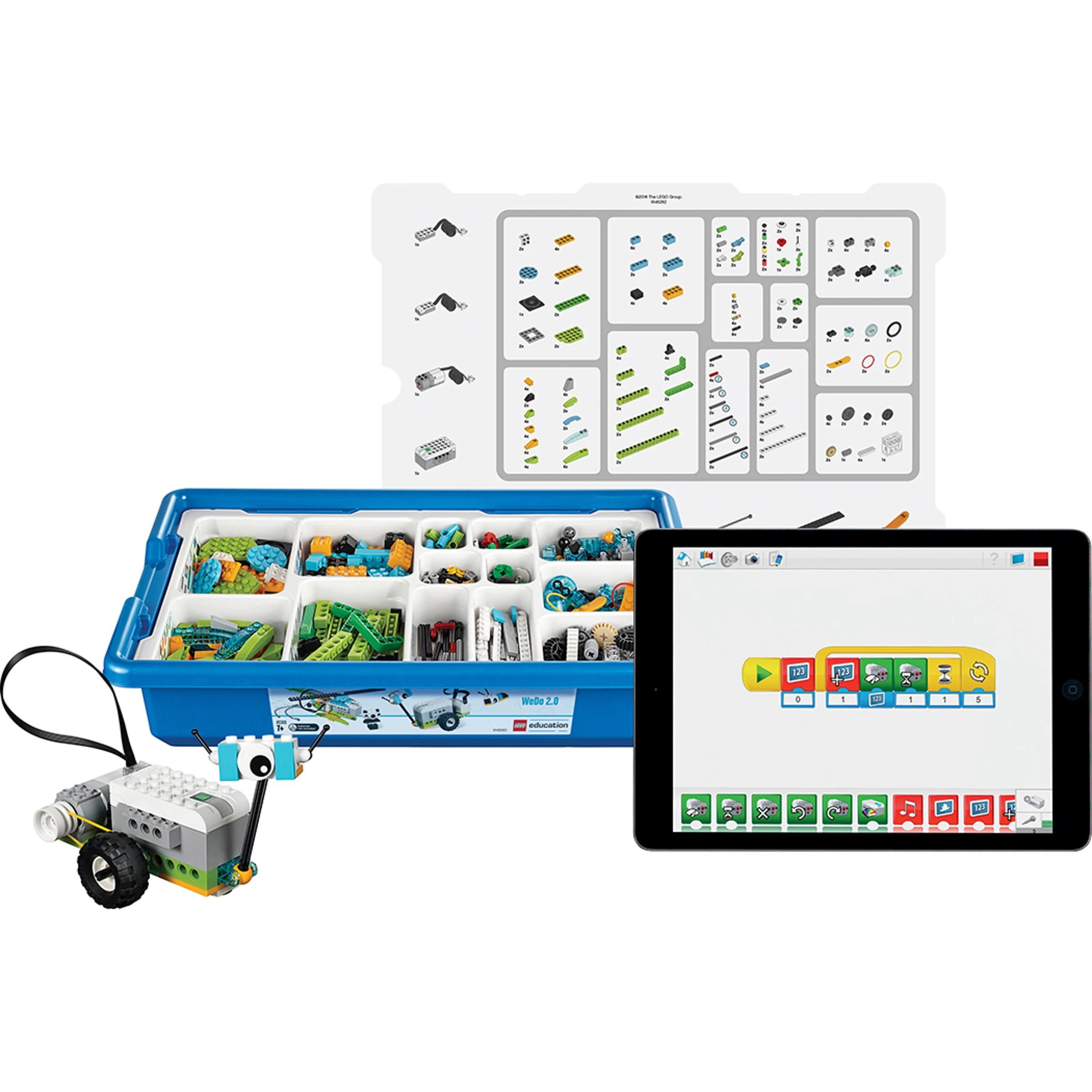 LEGO WeDo 2.0 robotics kit with various components and an iPad displaying the programming interface.