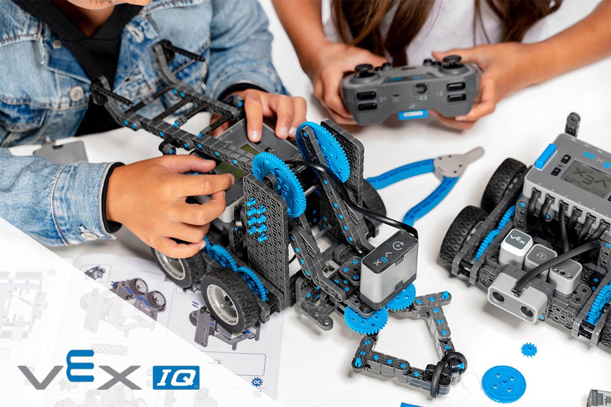 Close-up of children assembling a VEX IQ robotics kit.