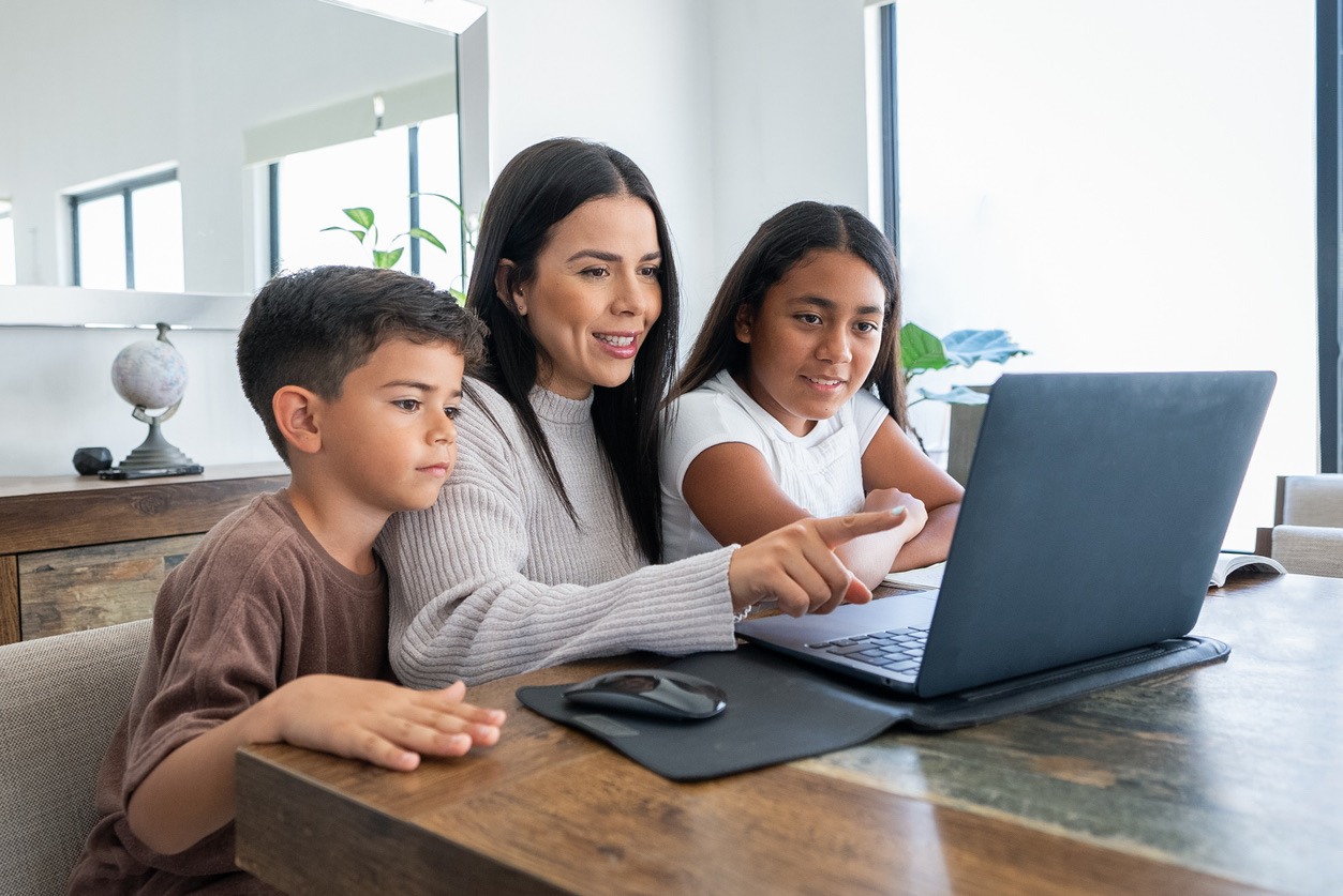 Mother and children learning AI concepts at home