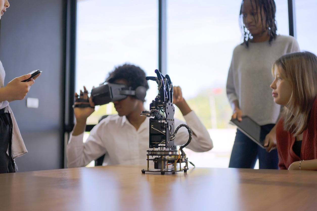 Students using VR and robotics to explore AI concepts